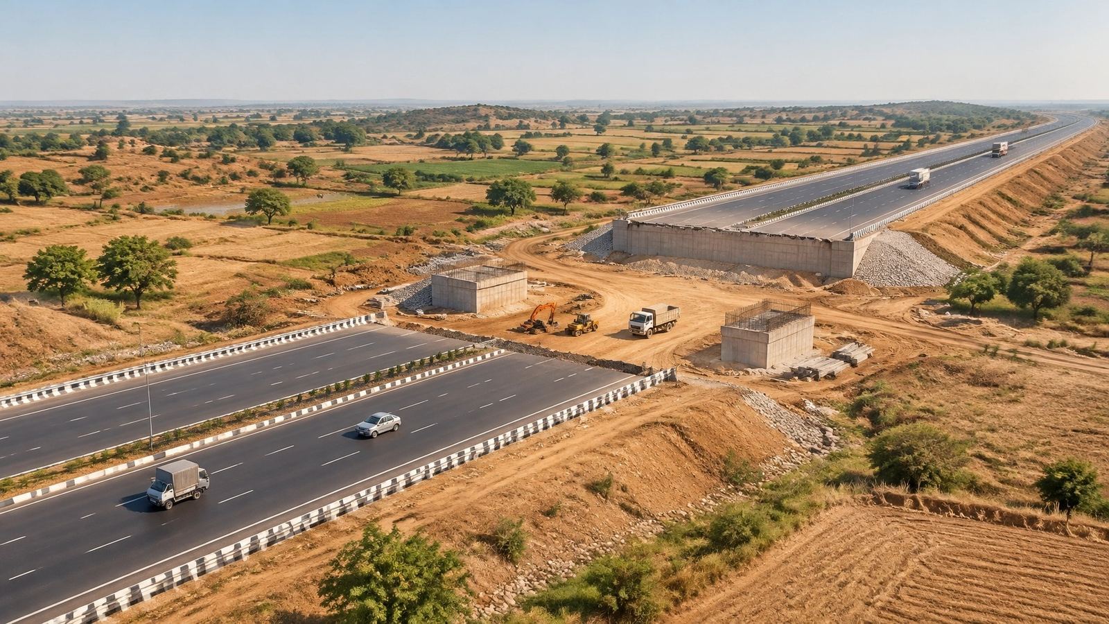 Illustration: aerial view of a newly built divided expressway crossing farmland, with trucks and cars on the open carriageway and an unfinished section under construction beside it