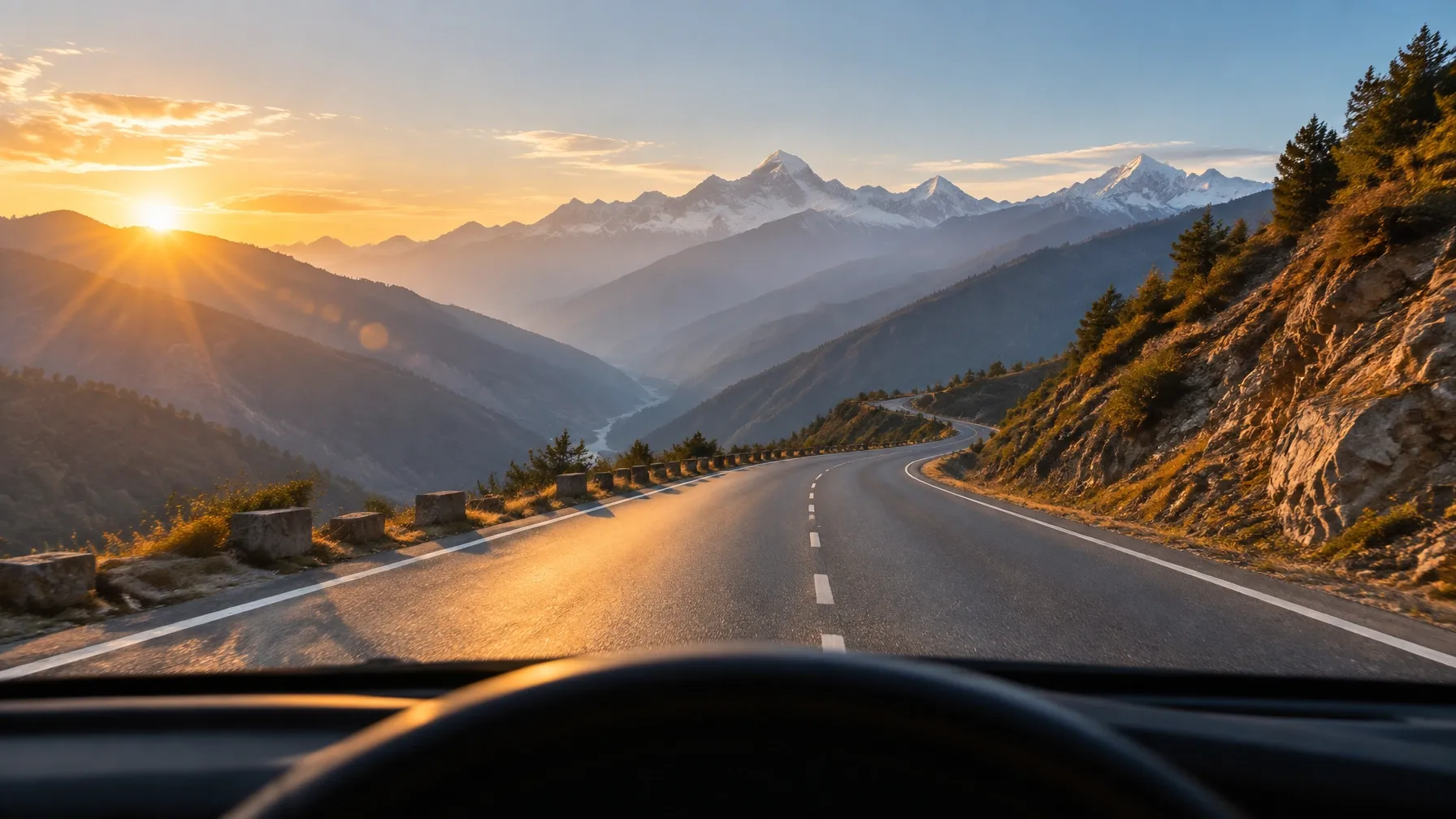 A mountain road winding through the Himalayas at dusk